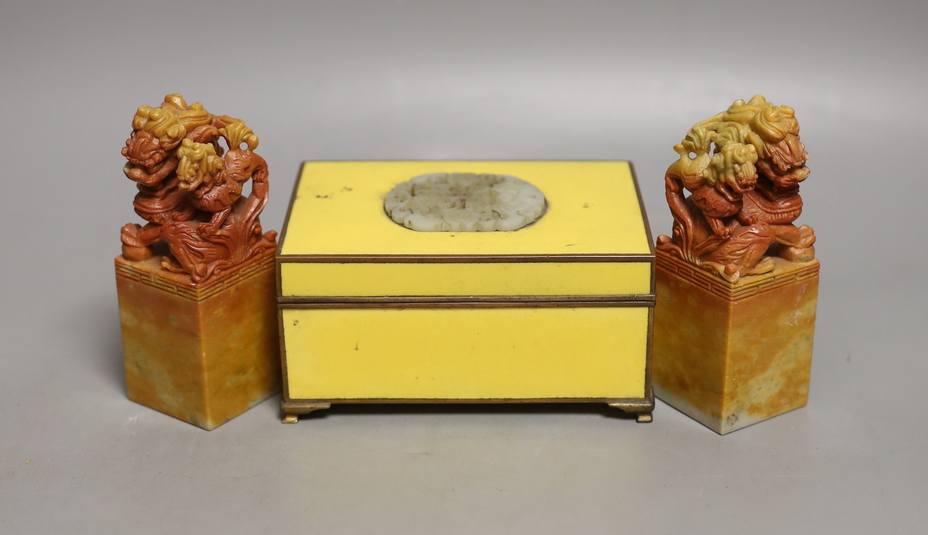 Two soapstone lion dogs and yellow enamelled box